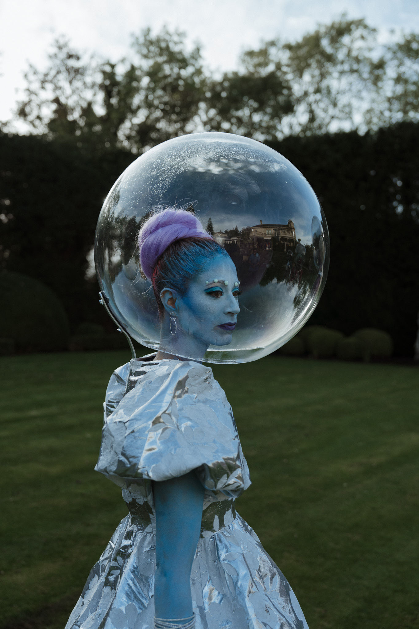 Blue bubble performer on garden lawn