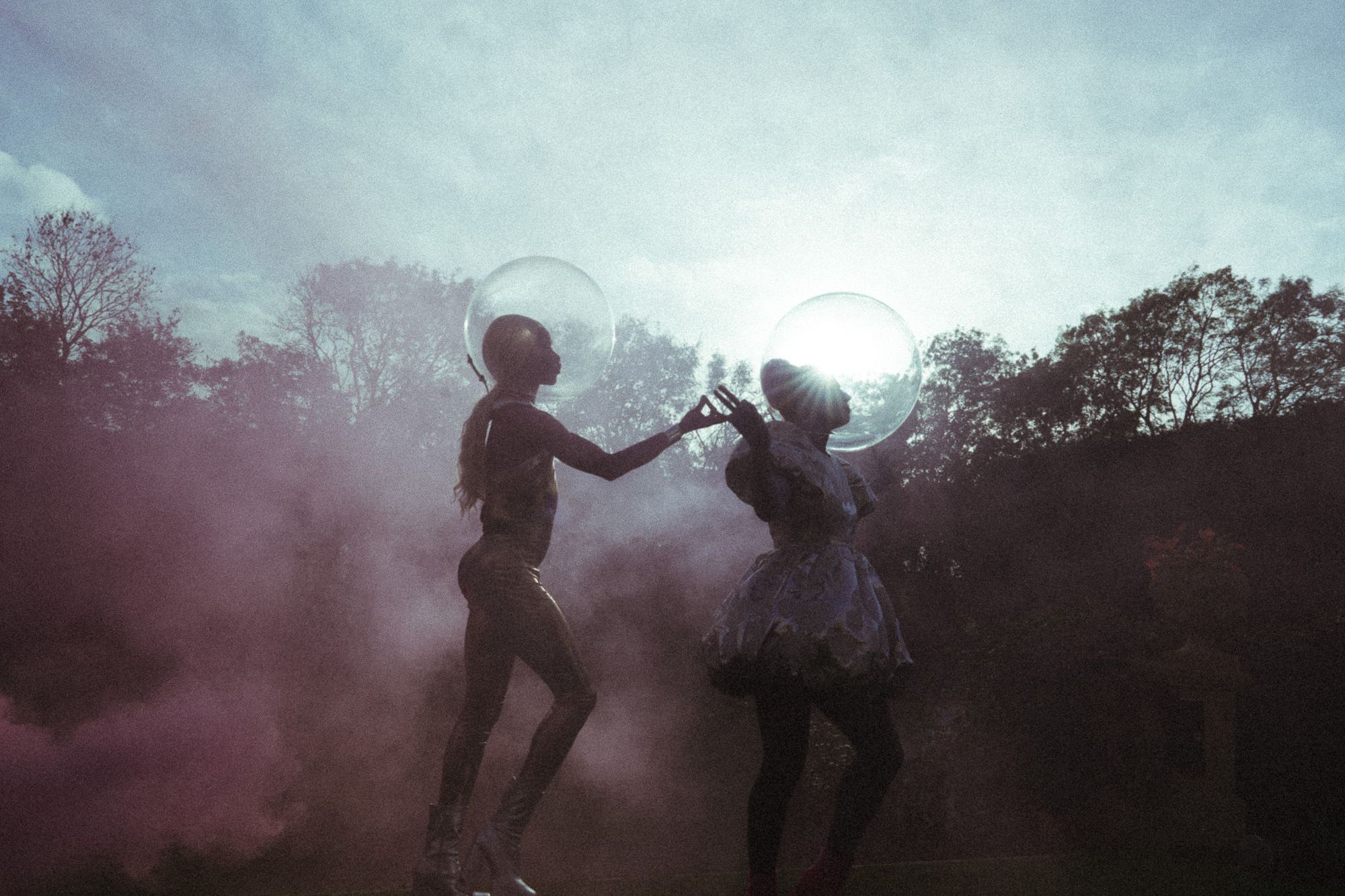Yes& immersive experience — bubble-helmeted performers in atmospheric smoke